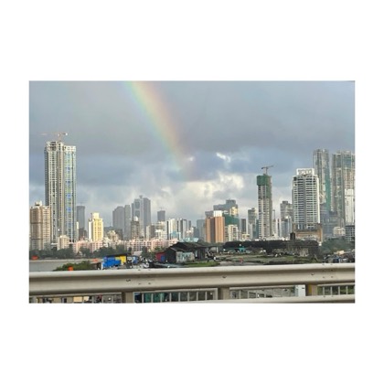 The Mumbai skyline under a rainbow, seen from the sea link